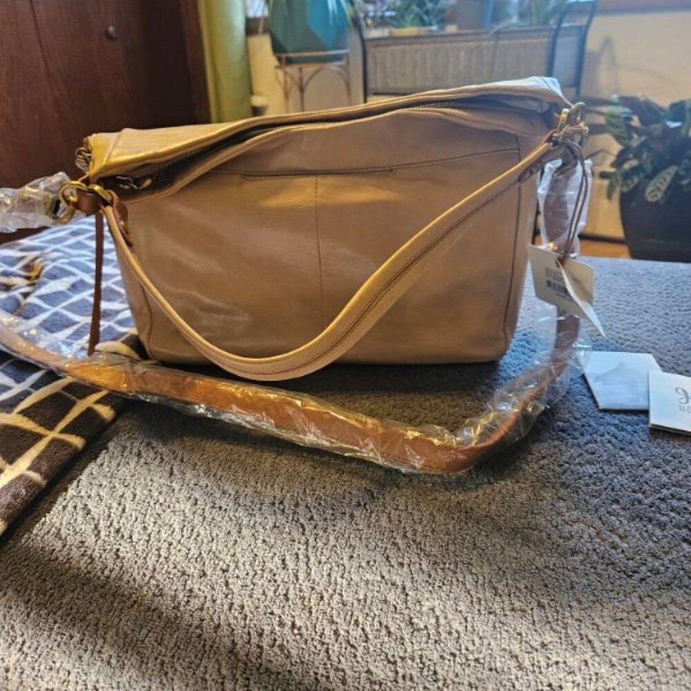 HOBO International bag. Cream/parchment. Leather. Brown long strap. NWT.
